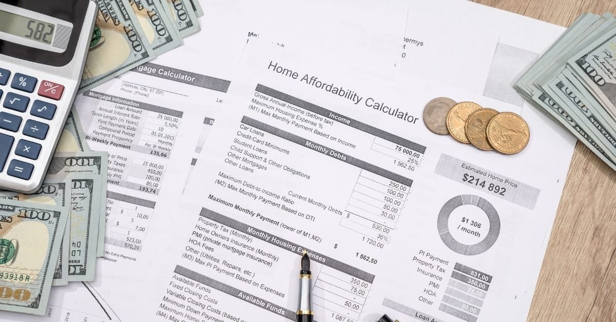 An accountant reviewing financial documents with a laptop and financial charts, representing professional bank statement editing services